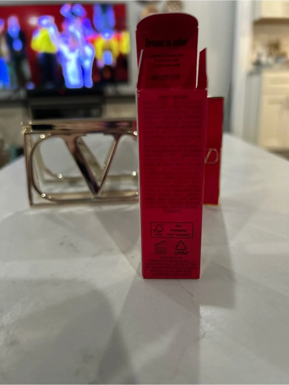 Valentino gold compact mirror with Valentino lipstick